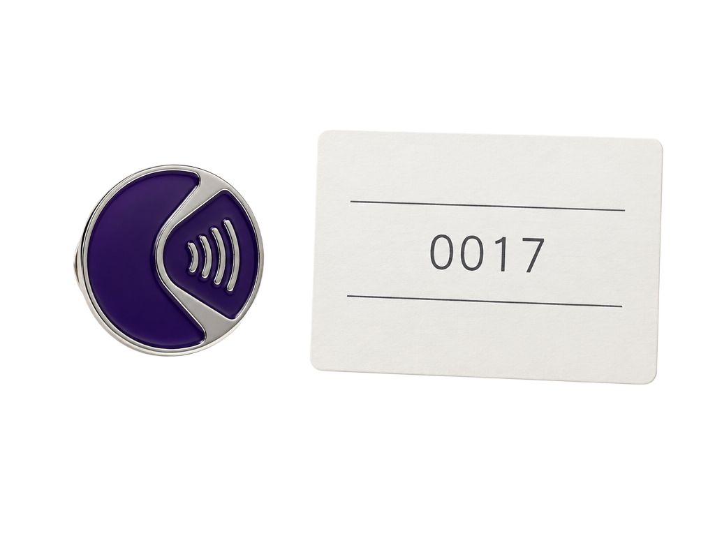 Collectible enamel pin badge with an NFC symbol beside a numbered certificate and a phone