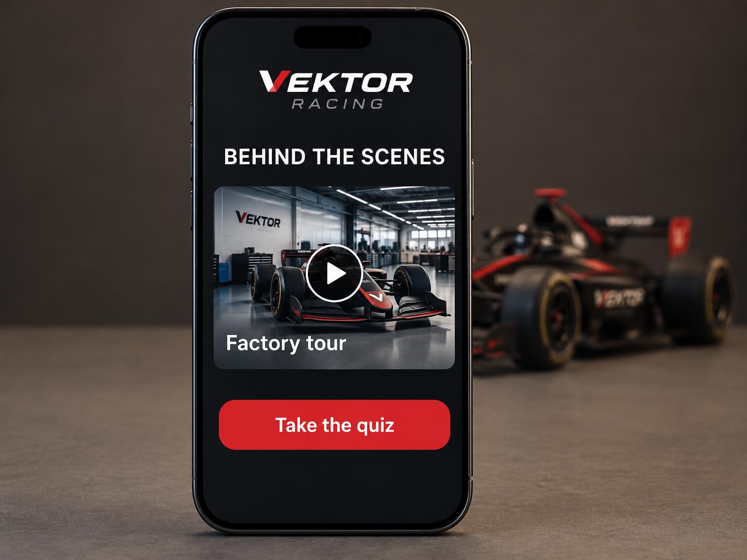 A phone showing a behind-the-scenes portal with a factory tour video and a quiz, with a model racing car blurred behind